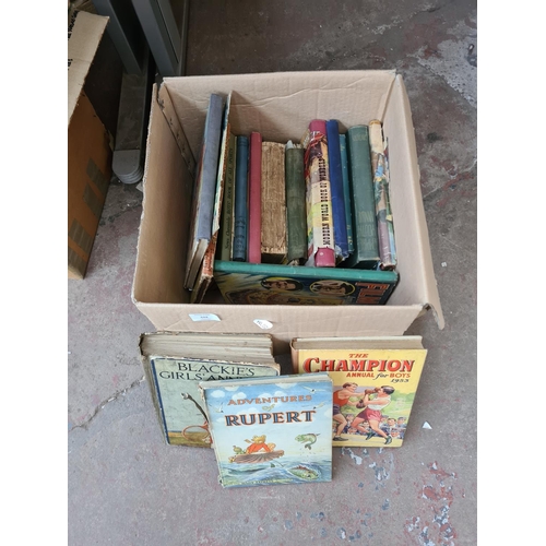 644 - A box containing assorted vintage books to include 1950's Boys book of all sports, The Dandy Monster... 