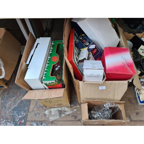 647 - Two boxes containing a large collection of assorted Christmas decorations