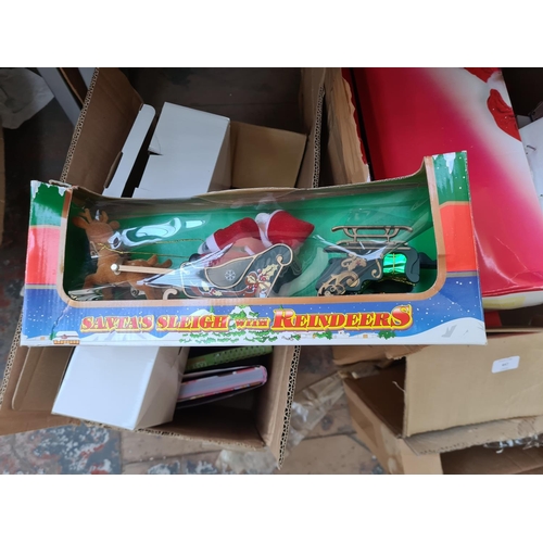 647 - Two boxes containing a large collection of assorted Christmas decorations