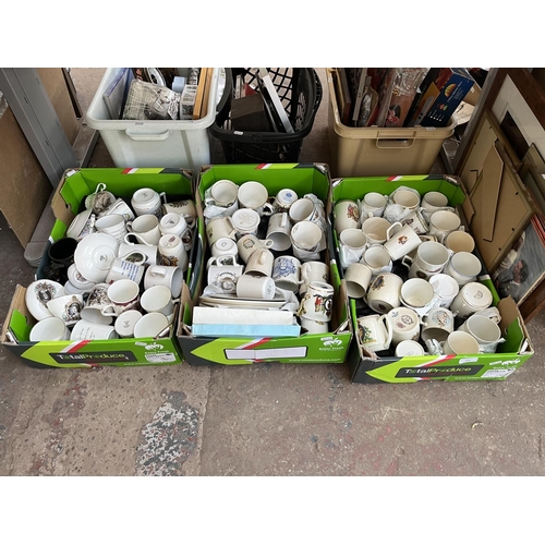 625 - Three boxes containing assorted ceramic commemorative mugs