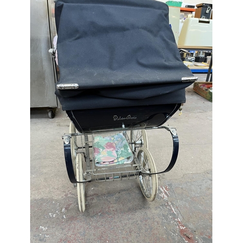 627 - A Silver Cross dolls pram with plastic doll