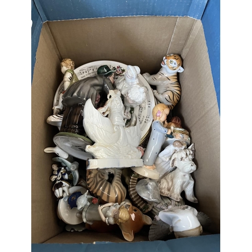 628 - Four boxes containing assorted ceramics to include Wade Whimsies, bird figurines, collectors plates ... 