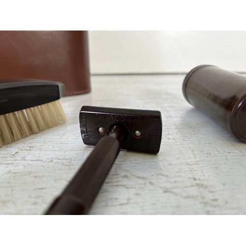 206 - Two leather cased travel grooming sets, one ebony and bakelite men's shaving and one women's vanity ... 