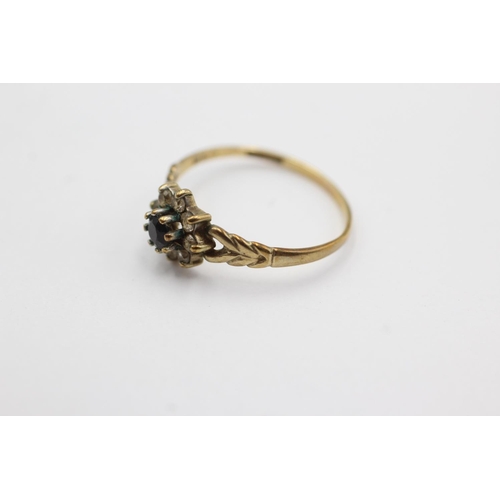 1001 - A 9ct gold clear gemstone and sapphire dress ring, size M½ - approx. gross weight 1.1 grams