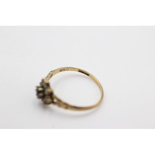 1001 - A 9ct gold clear gemstone and sapphire dress ring, size M½ - approx. gross weight 1.1 grams