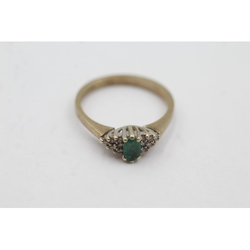 1004 - A hallmarked London 9ct gold emerald and diamond cluster dress ring, size N - approx. gross weight 2... 