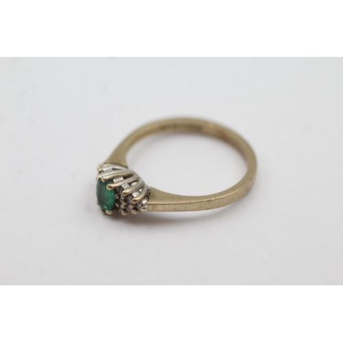 1004 - A hallmarked London 9ct gold emerald and diamond cluster dress ring, size N - approx. gross weight 2... 