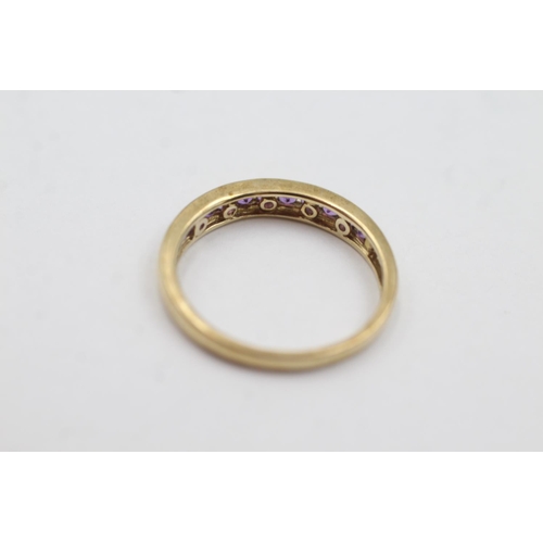 1008 - A hallmarked Birmingham 9ct gold amethyst channel setting half-eternity ring, size R½ - approx. gros... 