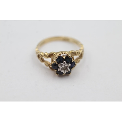 1010 - A hallmarked London 9ct gold diamond and sapphire ornate halo dress ring, size M - approx. gross wei... 