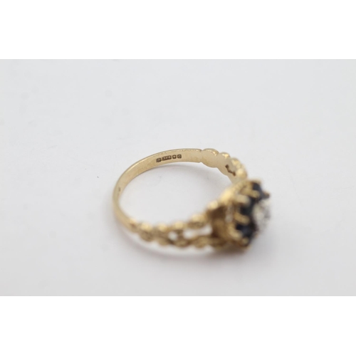 1010 - A hallmarked London 9ct gold diamond and sapphire ornate halo dress ring, size M - approx. gross wei... 