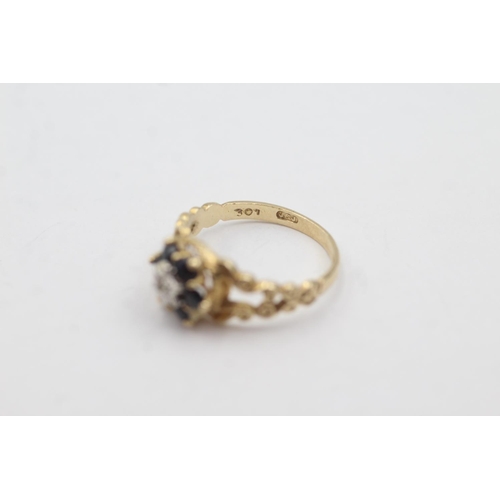 1010 - A hallmarked London 9ct gold diamond and sapphire ornate halo dress ring, size M - approx. gross wei... 