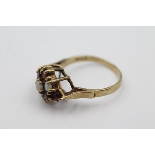 1011 - A 9ct gold opal and garnet dress ring, size P½ - approx. gross weight 3.2 grams