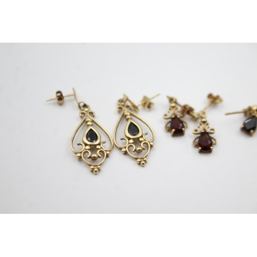 1012 - Three pairs of 9ct gold gemstone drop earrings, two sapphire and one garnet - approx. gross weight 4... 