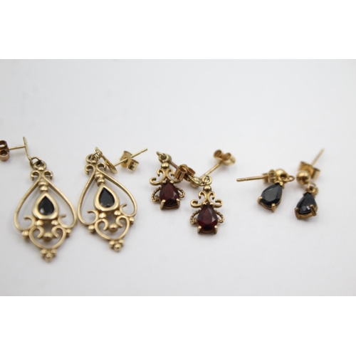 1012 - Three pairs of 9ct gold gemstone drop earrings, two sapphire and one garnet - approx. gross weight 4... 