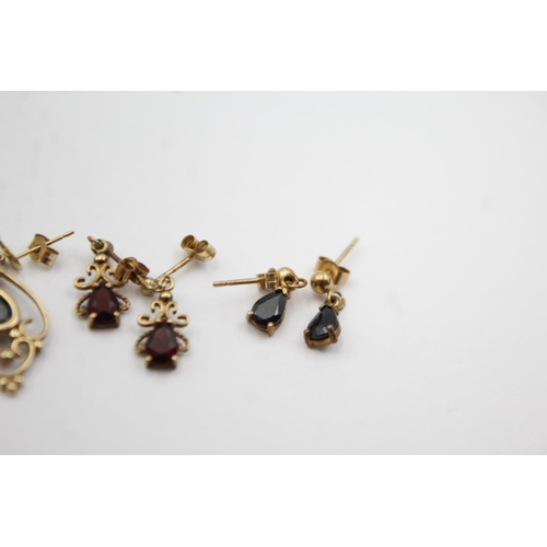 1012 - Three pairs of 9ct gold gemstone drop earrings, two sapphire and one garnet - approx. gross weight 4... 