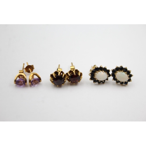 1013 - Three pairs of 9ct gold gemstone stud earrings, one amethyst, one garnet and one opal and sapphire -... 