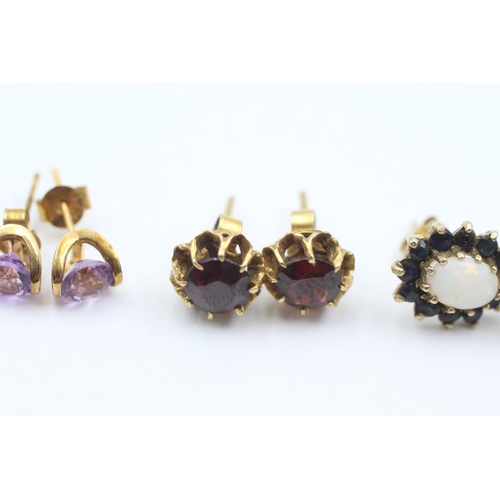 1013 - Three pairs of 9ct gold gemstone stud earrings, one amethyst, one garnet and one opal and sapphire -... 