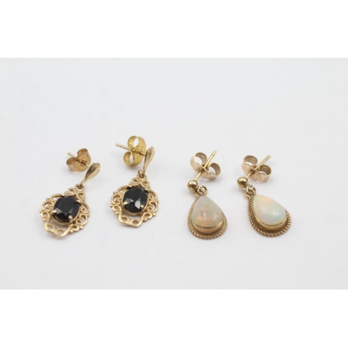 1014 - Two pairs of 9ct gold gemstone drop earrings, one opal and one sapphire - approx. gross weight 3.2 g... 