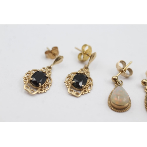 1014 - Two pairs of 9ct gold gemstone drop earrings, one opal and one sapphire - approx. gross weight 3.2 g... 