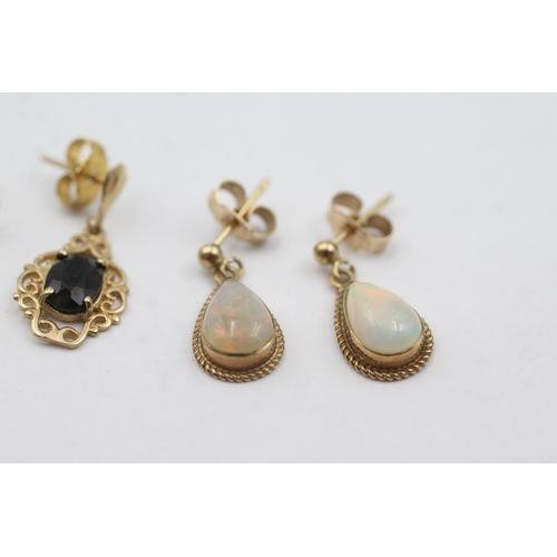 1014 - Two pairs of 9ct gold gemstone drop earrings, one opal and one sapphire - approx. gross weight 3.2 g... 