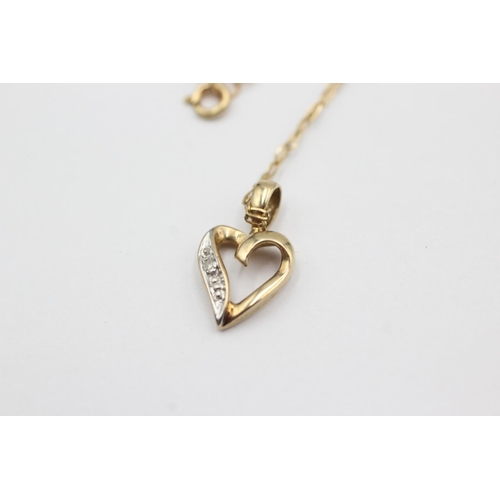 1016 - A 9ct gold diamond set heart pendant necklace - approx. gross weight 0.9 grams