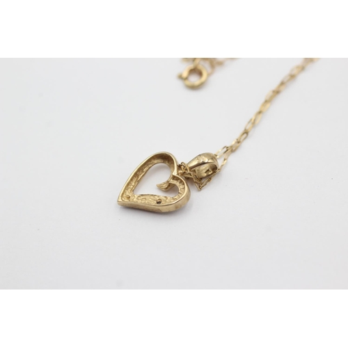 1016 - A 9ct gold diamond set heart pendant necklace - approx. gross weight 0.9 grams