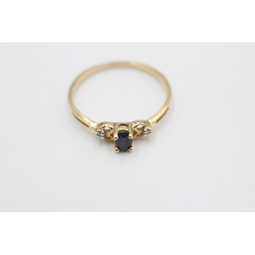 1019 - A 9ct gold sapphire and diamond three stone dress ring, size N½ - approx. gross weight 1.1 grams