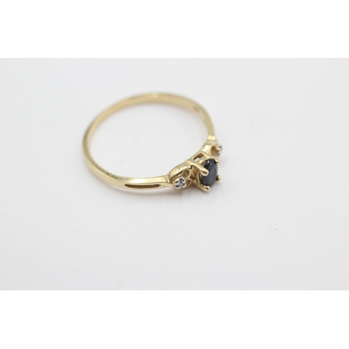 1019 - A 9ct gold sapphire and diamond three stone dress ring, size N½ - approx. gross weight 1.1 grams