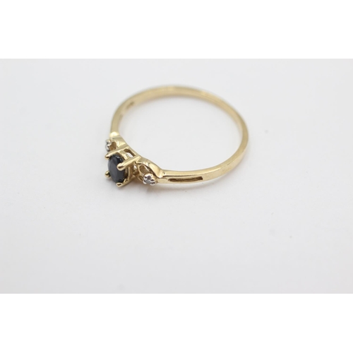 1019 - A 9ct gold sapphire and diamond three stone dress ring, size N½ - approx. gross weight 1.1 grams