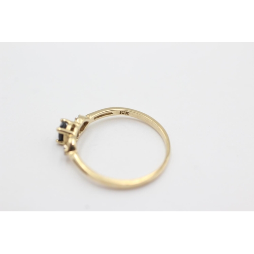 1019 - A 9ct gold sapphire and diamond three stone dress ring, size N½ - approx. gross weight 1.1 grams