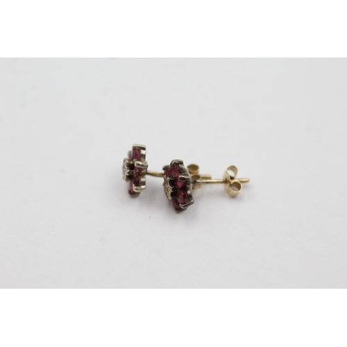 1032 - A pair of 9ct gold diamond and ruby cluster stud earrings - approx. gross weight 0.9 grams