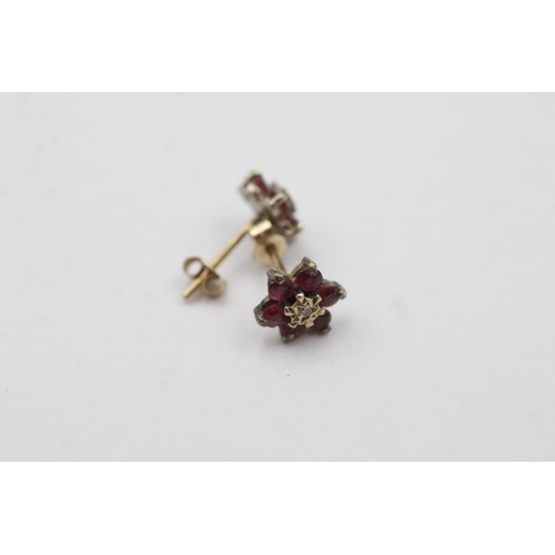 1032 - A pair of 9ct gold diamond and ruby cluster stud earrings - approx. gross weight 0.9 grams