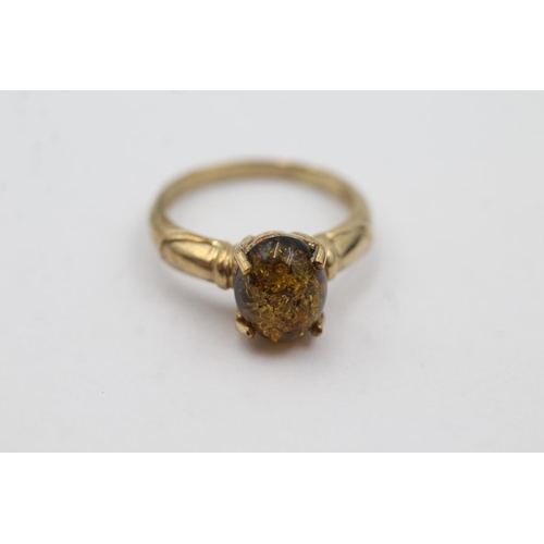 1035 - A hallmarked Birmingham 9ct gold amber solitaire dress ring, size N - approx. gross weight 2.9 grams