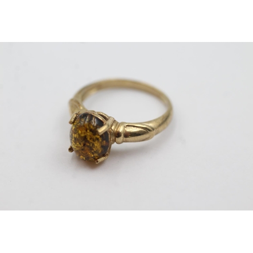 1035 - A hallmarked Birmingham 9ct gold amber solitaire dress ring, size N - approx. gross weight 2.9 grams