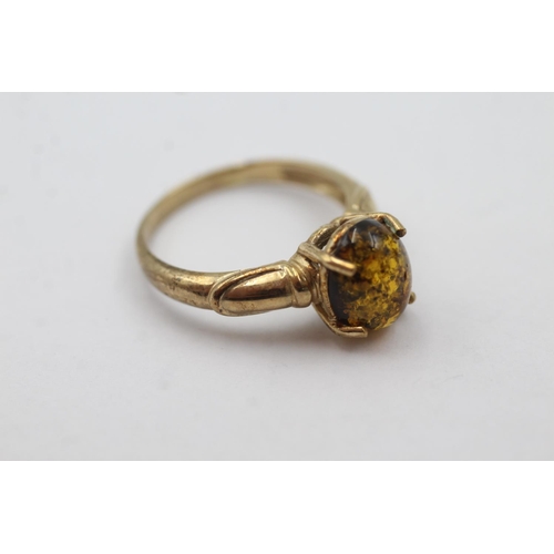 1035 - A hallmarked Birmingham 9ct gold amber solitaire dress ring, size N - approx. gross weight 2.9 grams