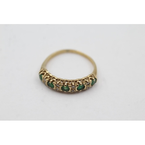 1043 - A 9ct gold emerald and diamond half-eternity ring, size J - approx. gross weight 1.3 grams