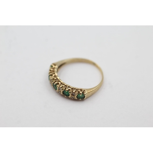 1043 - A 9ct gold emerald and diamond half-eternity ring, size J - approx. gross weight 1.3 grams