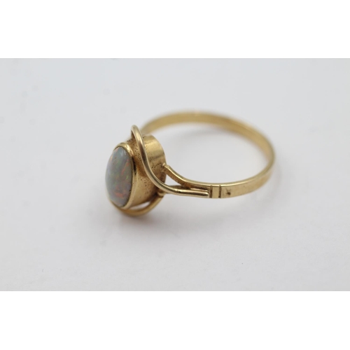 1045 - A 14ct gold opal solitaire dress ring, size O - approx. gross weight 2.6 grams