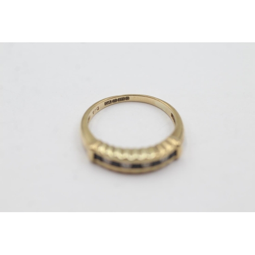 1047 - A hallmarked Sheffield 9ct gold sapphire and diamond channel setting half-eternity ring, size N½ - a... 