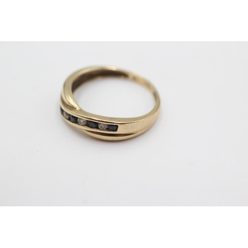 1048 - A hallmarked London 9ct gold sapphire and clear gemstone channel set ring, size M½ - approx. gross w... 