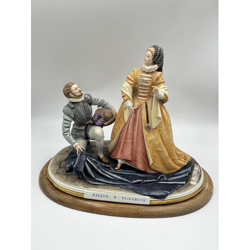 11 - A Capodimonte Ralegh & Elizabeth ceramic figurine signed B. Merli on wooden plinth - approx. 27cm hi... 