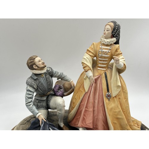 11 - A Capodimonte Ralegh & Elizabeth ceramic figurine signed B. Merli on wooden plinth - approx. 27cm hi... 