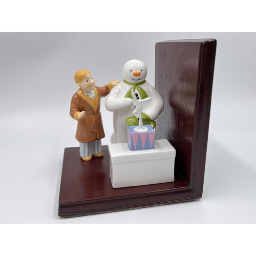 23 - Two boxed Snowman figurines, one Coalport 'The Snowman' and one Royal Doulton 'Snowdrift Leads The W... 