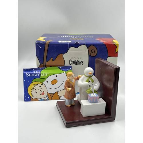 23 - Two boxed Snowman figurines, one Coalport 'The Snowman' and one Royal Doulton 'Snowdrift Leads The W... 