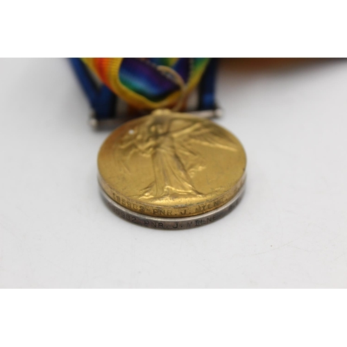 1075 - A WWI medal pair with original ribbons presented to 195982 PNR. J. Milre R.E.