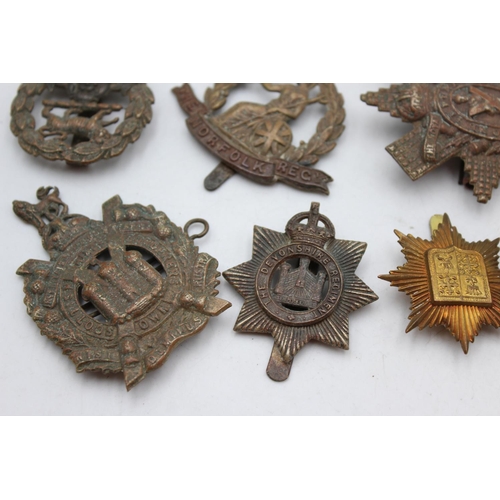 1081 - Twelve assorted vintage military cap badges to include Scottish, Norfolk Regt. Etc.