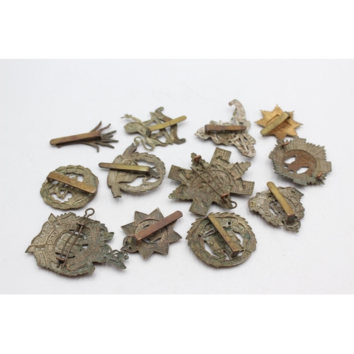 1081 - Twelve assorted vintage military cap badges to include Scottish, Norfolk Regt. Etc.