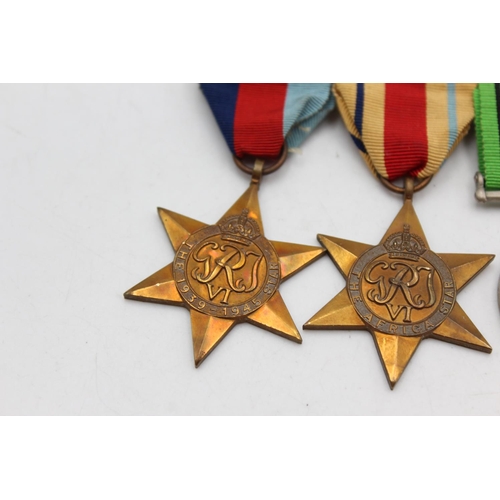 1103 - A WWII mounted medal group comprising Africa Star, 1939-45 Star, War and Defence