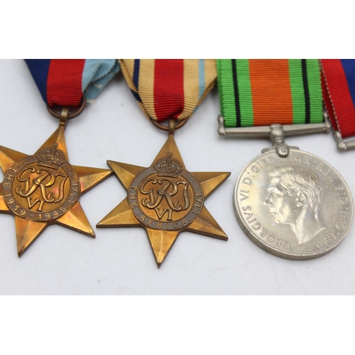 1103 - A WWII mounted medal group comprising Africa Star, 1939-45 Star, War and Defence