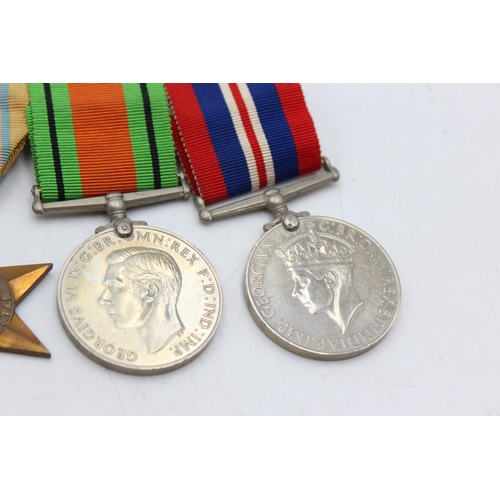 1103 - A WWII mounted medal group comprising Africa Star, 1939-45 Star, War and Defence